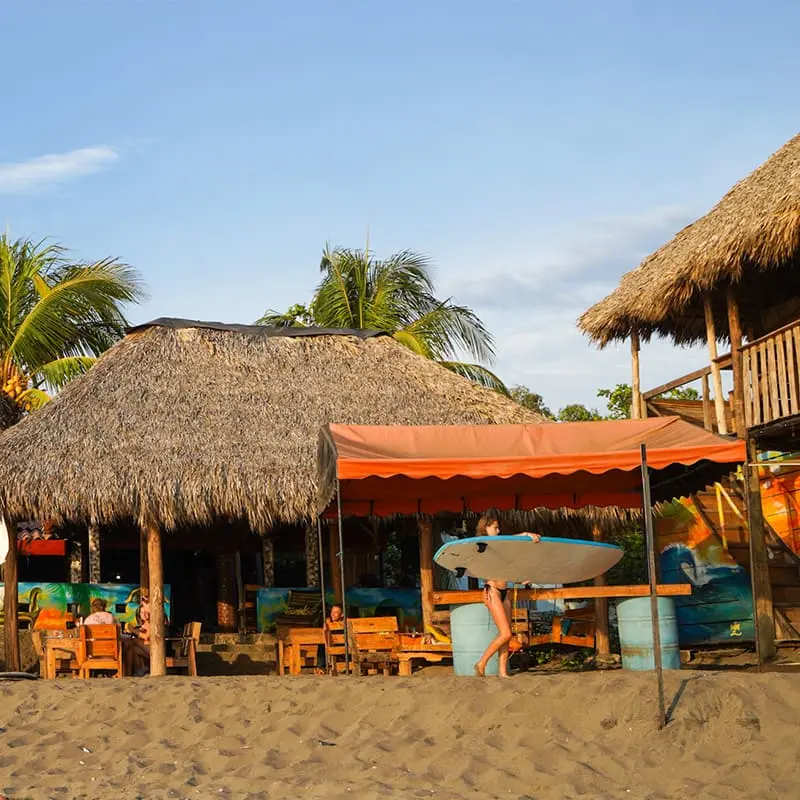 PROPERTY · The Simple Beach Lodge — beachfront pool deck at dusk, Las Peñitas